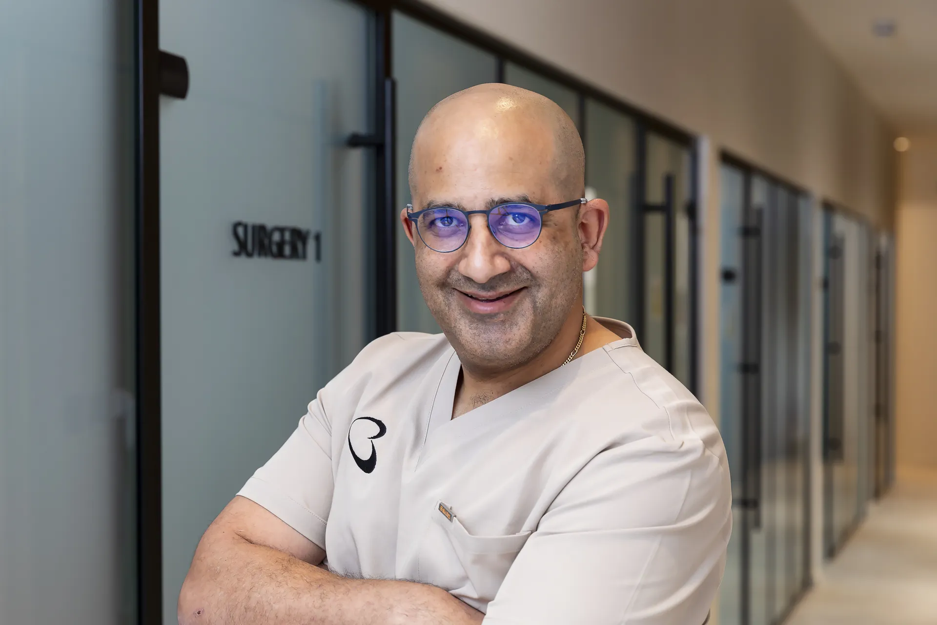 Dr Michael Boulis smiling outside Surgery 1 at Bella Dental