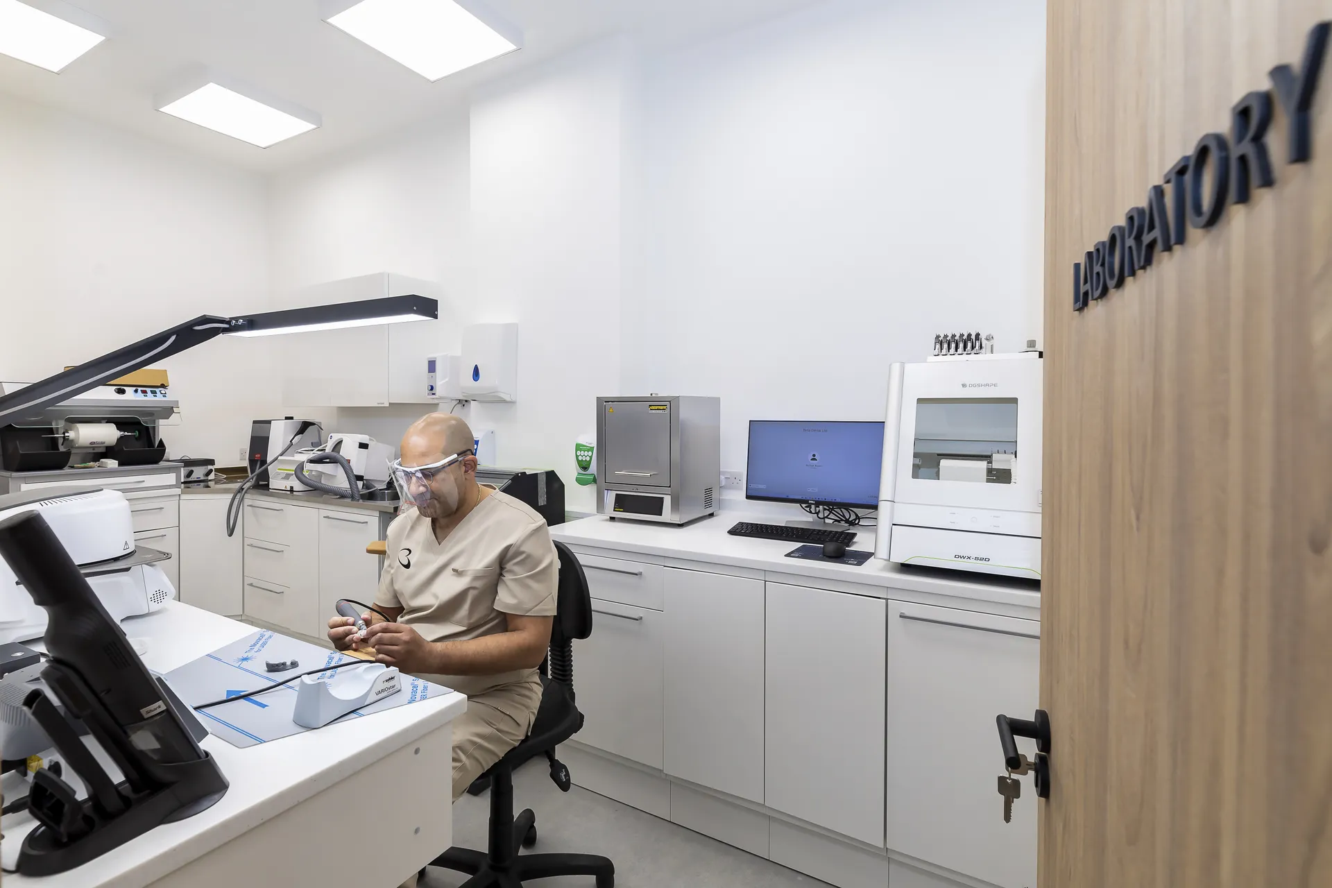 Technician working on a dental model in the Bella Dental on-site lab