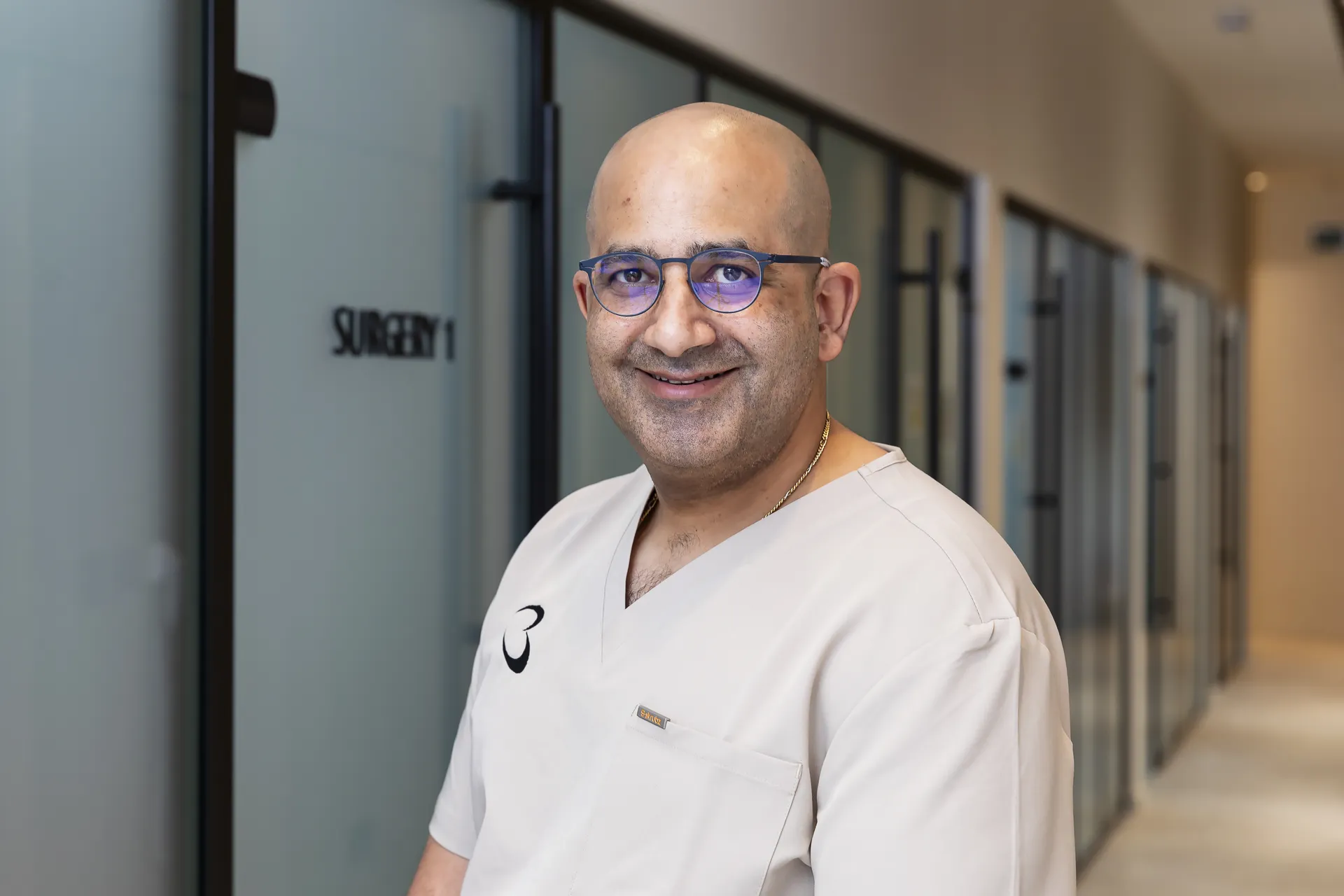 Dr Michael Boulis smiling in the corridor at Bella Dental